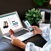 Young woman order or purchase product on internet using laptop and make transaction payment by smartphone. Online shopping lifestyle with credit card via internet banking on mobile application. Blithe