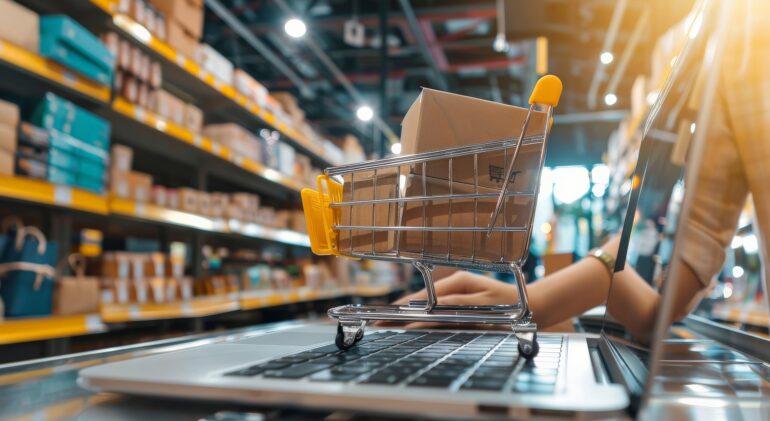 Person setting up an online store, uploading products on a laptop Person setting up an online store, uploading products on a laptop